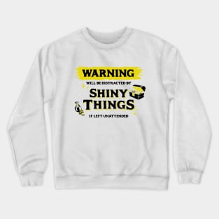 Distracted by Shiny Things  if Left Unattended Dark Yellow Warning Label Crewneck Sweatshirt